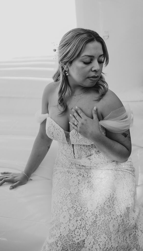 bride with hand on chest 